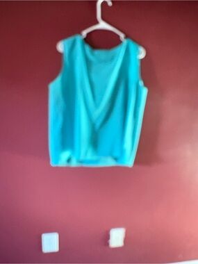 Women's Sleeveless V-Neck Tank Top in Turquoise comes with a skirt. Slide to see